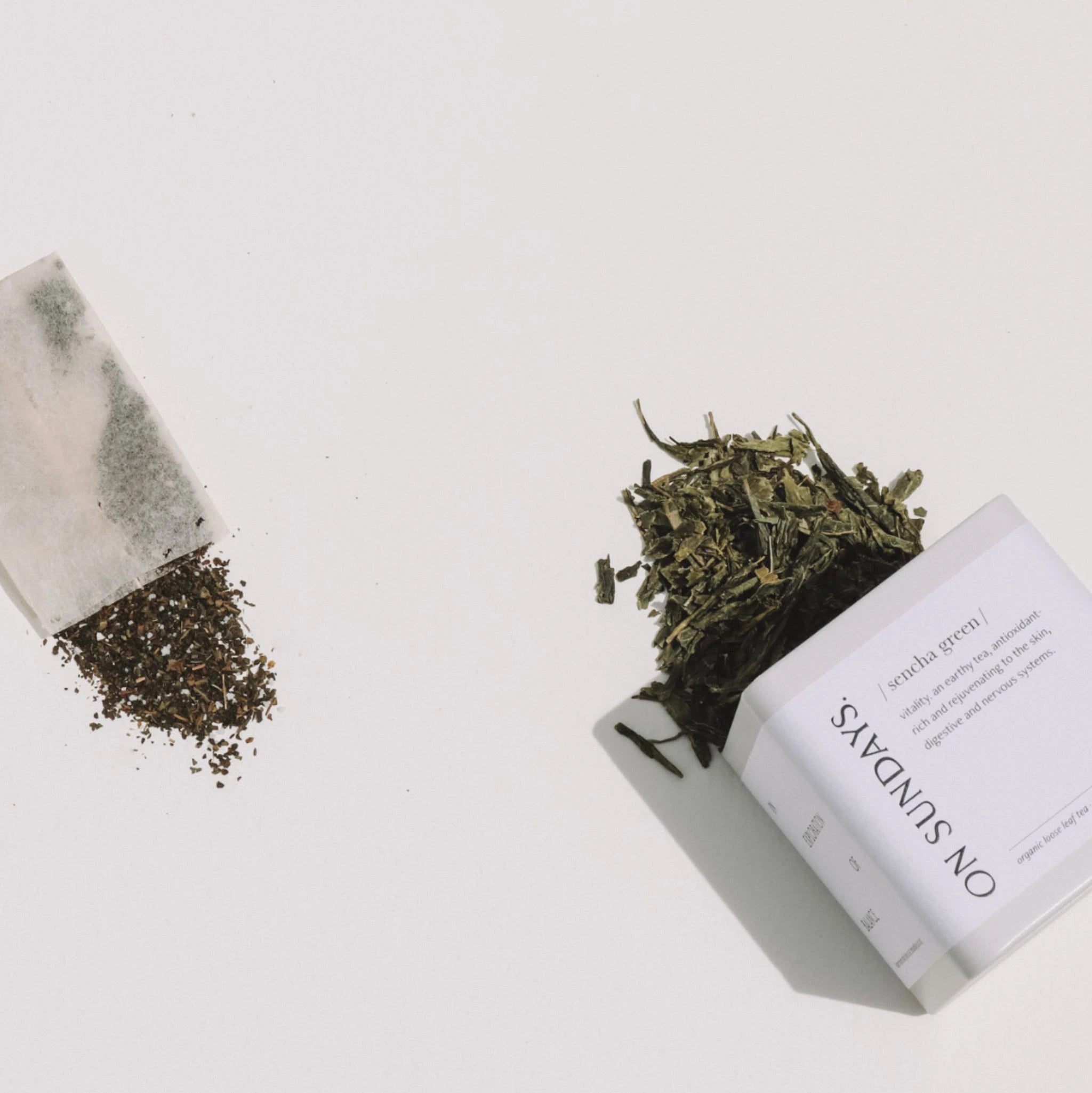 Side-by-side comparison of loose leaf Sencha green tea and a tea bag, illustrating On Sundays’ commitment to quality, freshness, and a more intentional tea ritual.