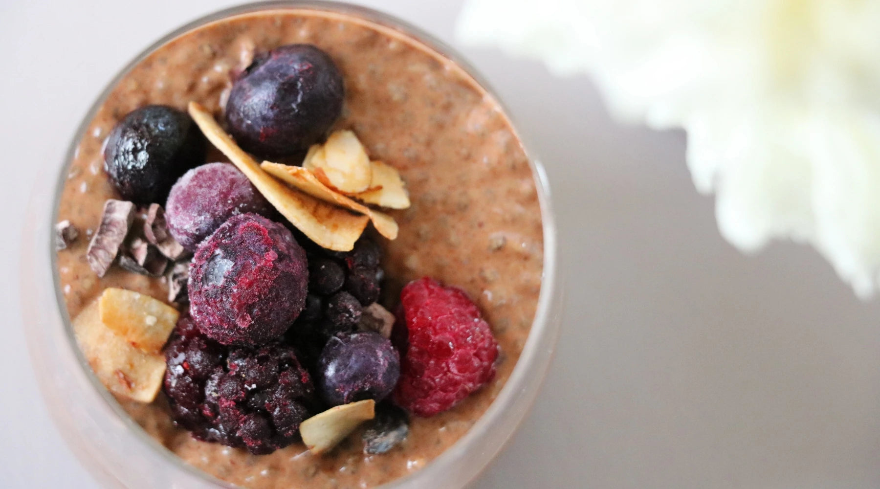 A nourishing chia pudding topped with frozen berries, cacao nibs, and dried fruit crisps. A wholesome, nutrient-dense recipe crafted with all-natural whole foods, expertly paired to enhance bioavailability and support optimal health. Recipe created exclusively for Intentionally Natural